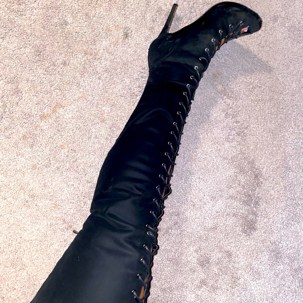 Thigh high lace up boot heels